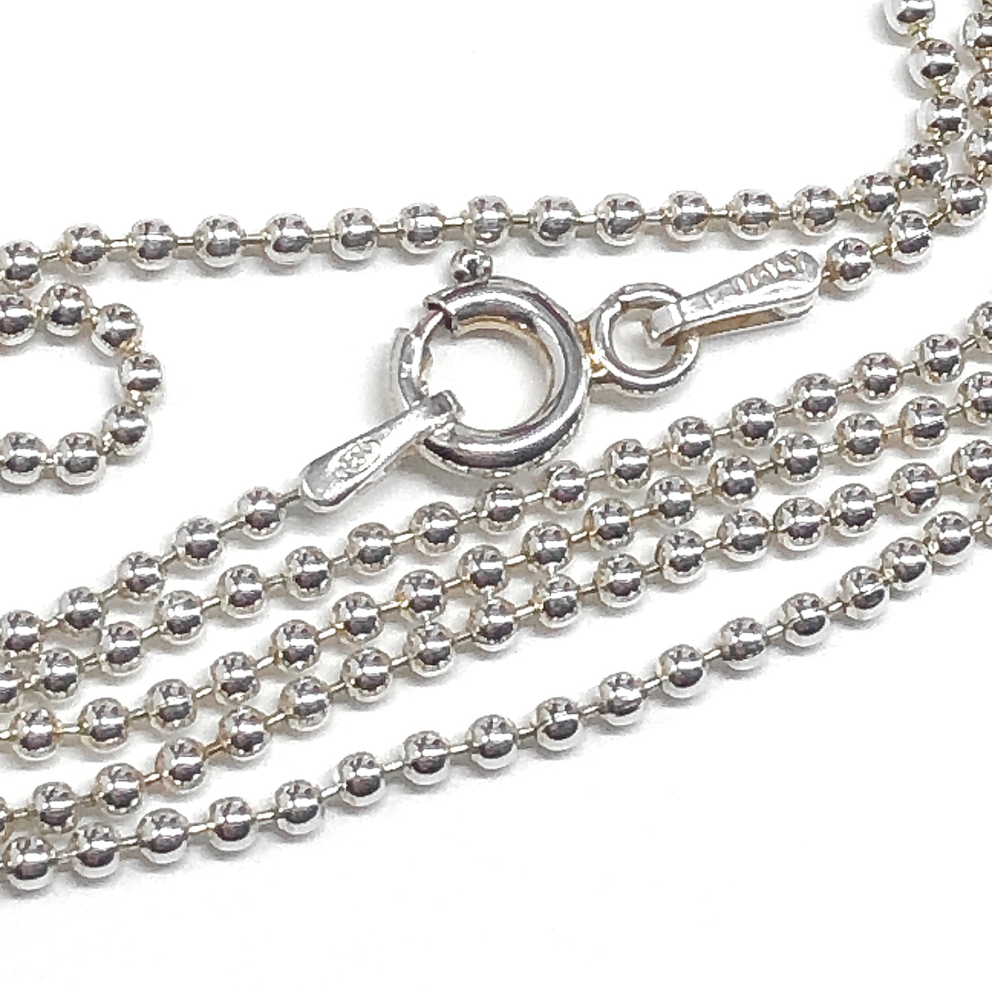 Silver ball chain necklace with clasp on a white background