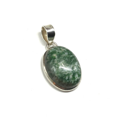 Green stone pendant with sterling silver setting