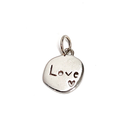 Silver pendant with 'LOVE' engraving on a white background