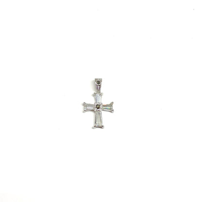 Silver cross pendant on a white background
