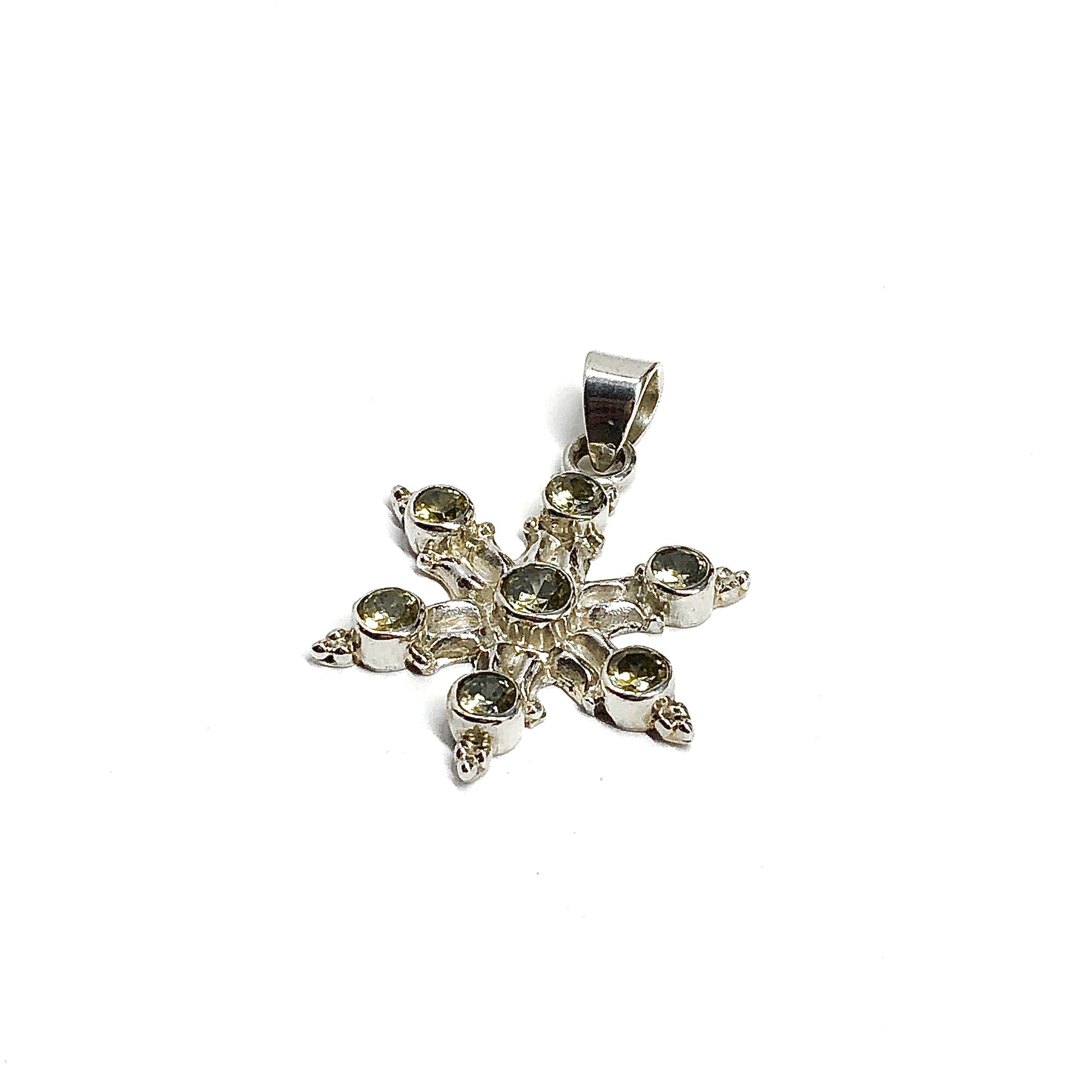 Silver pendant with gemstones on a white background