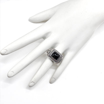 925 Silver ring bold rectangle style with a black gemstone on a white mannequin hand