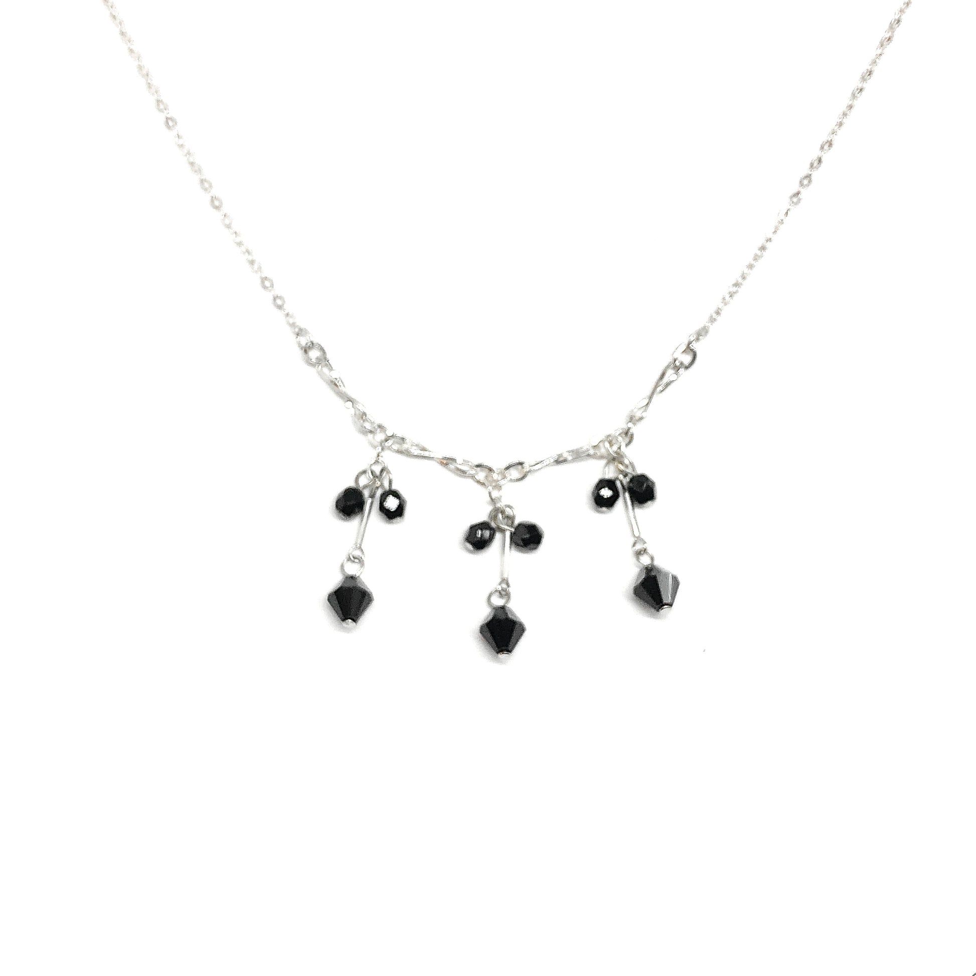 Sterling Silver Negligee Necklace with black crystal bead tassels on a white background