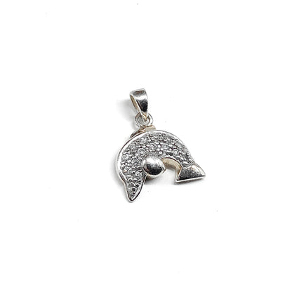 Silver pendant with intricate dolphin design