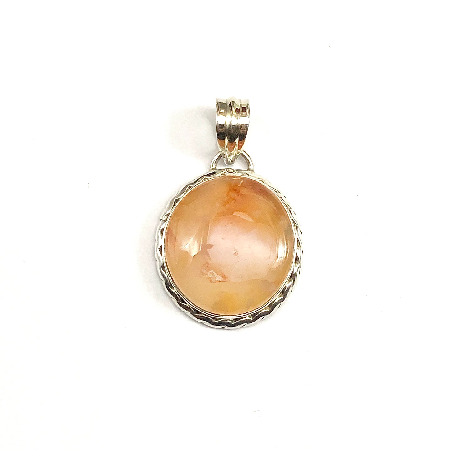 A round fiery orange-colored cabochon carnelian stone pendant set in a 925 silver bezel with a rope border.