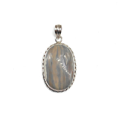 An oval pendant featuring a brown marbled stone in a roped 925 silver bezel setting, suspended from a matching silver bail.