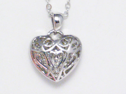 ornate filigree reversible pendant to iced out cz heart necklace sterling silver at blingschlingers.com
