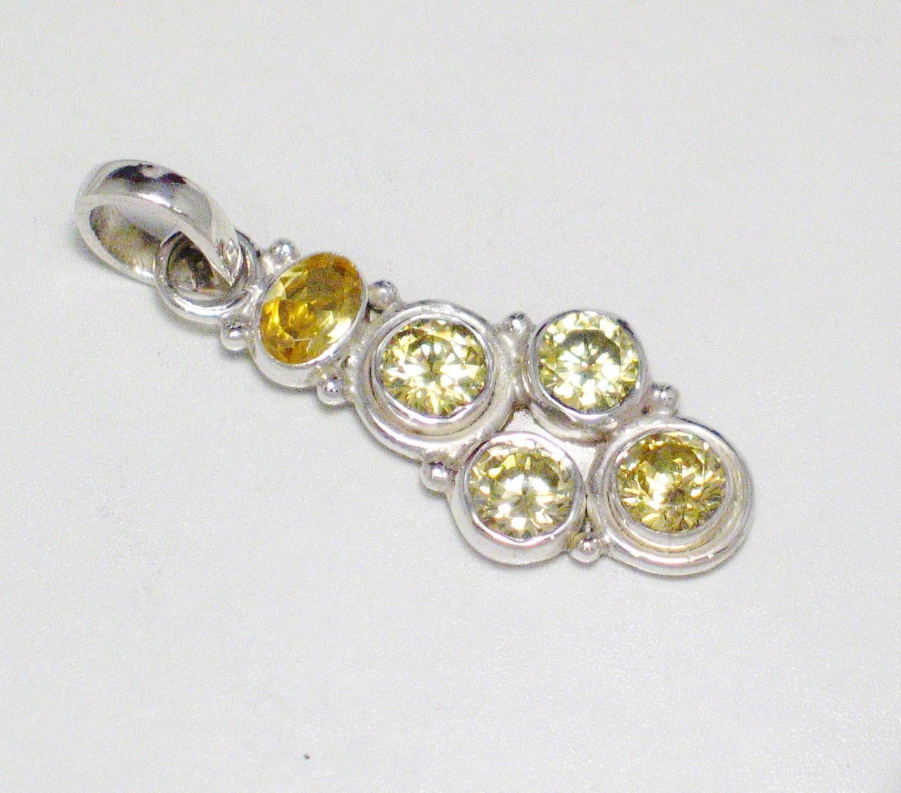 Silver Pendants | Shimmery Canary Yellow Shifting Cubic Zirconia Pendant | Overstock Jewelry online Blingschlingers.com