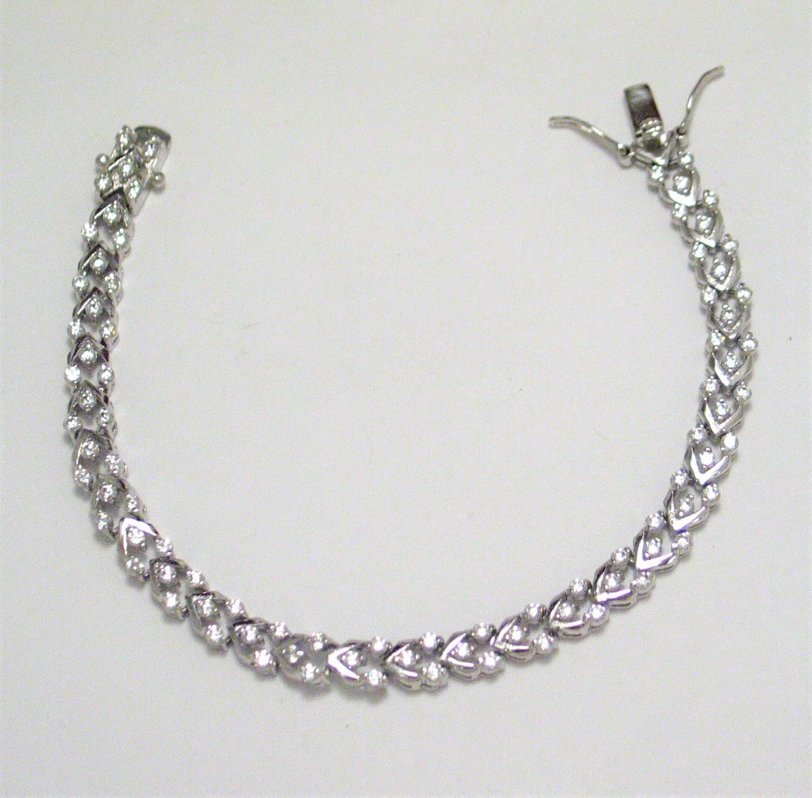 Sterling Silver Bracelet, 7" Shimmering Chevron Design Zirconia Stone Tennis Bracelet - Blingschlingers Jewelry